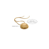 Gold necklace with measurement details on a white background