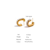 Gold hoop earrings with cubic zirconia on a white background