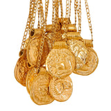 Gold coin zodiac vintage pendant necklaces with chains on a white background
