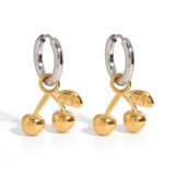 Gold cherry-shaped earrings on a white background