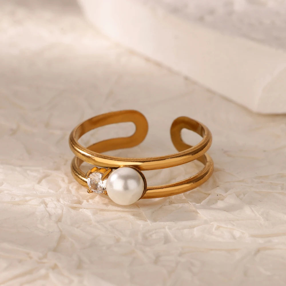Modern Adjustable Double Band Pearl Ring with 18K gold plating, accented with a pearl and crystal for a refined, elegant style.