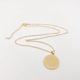 Adjustable evil eye necklace with white enamel, blue accents, and gold plated finish, ideal for gifting or layering.