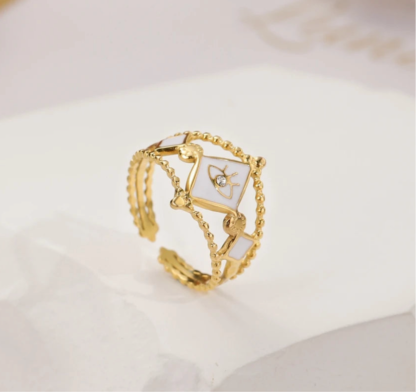 Evil eye CZ enamel ring with gold-plated stainless steel, featuring white enamel and bold design, adjustable and retro-inspired.