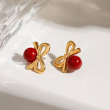 Playful Gold Cherry Bow Earring with a glossy red stone, 18K gold-plated, adding a charming and elegant touch to your look.