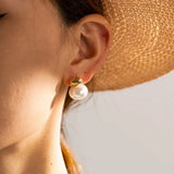Classic Gold Double Pearl Stud Earrings, 18K gold-plated with a lustrous white pearl and polished gold cap, ideal for both casual and formal wear.