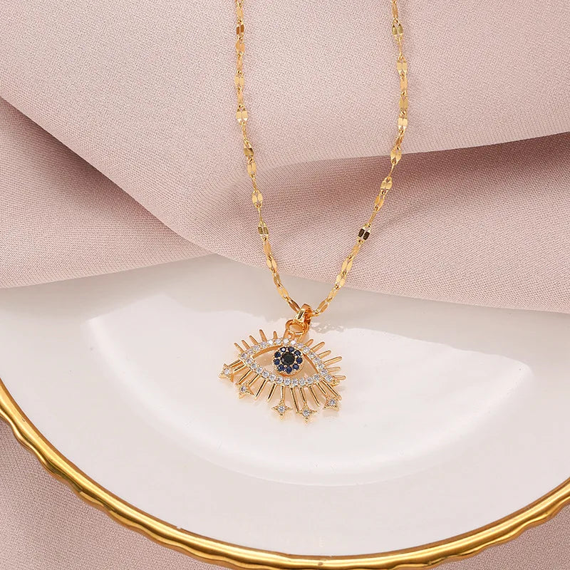 Minimalist gold evil eye pendant necklace made with copper and cubic zirconia for daily protective wear