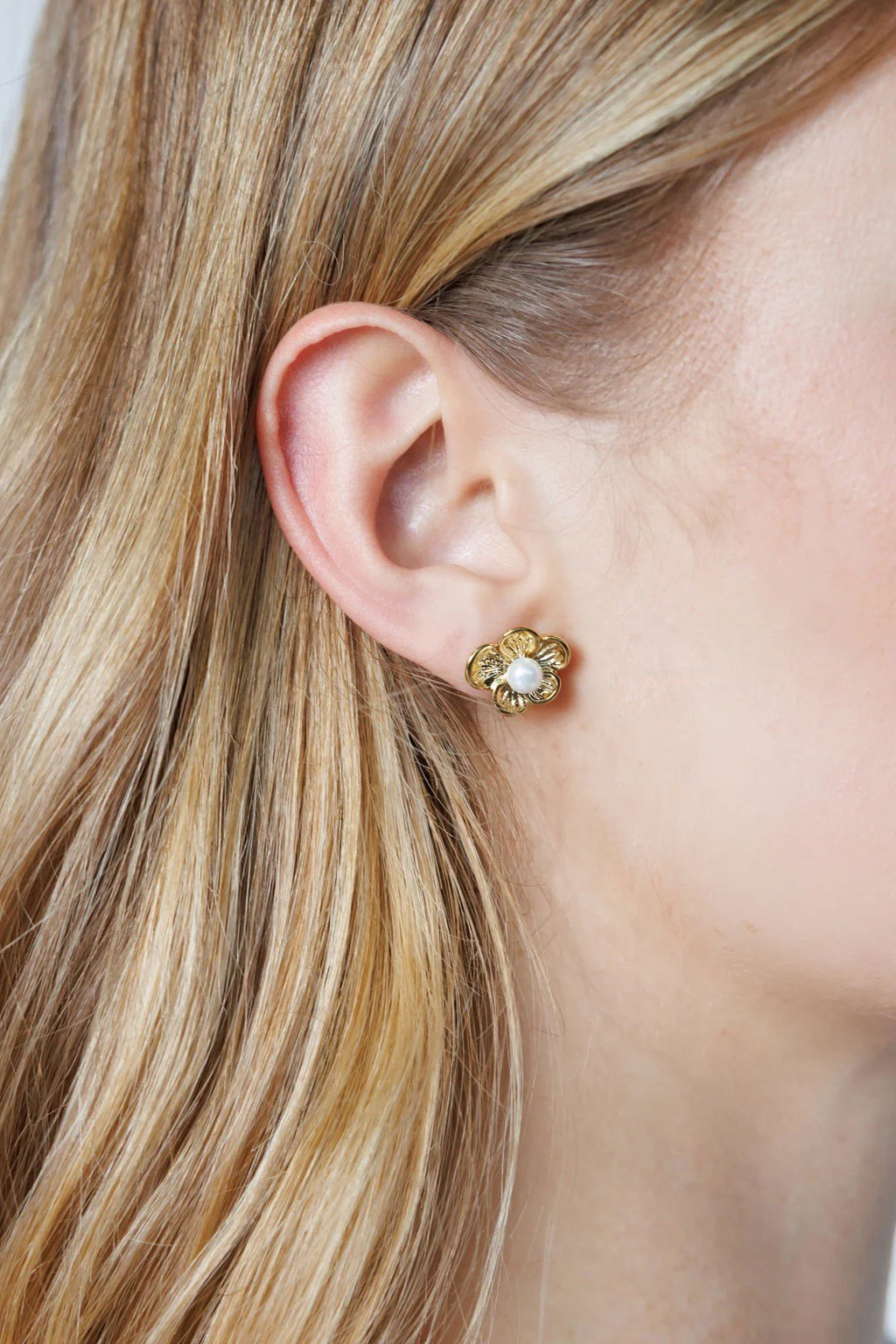 Elegant gold-plated pearl flower earrings with oversized floral design for a bold, stylish look