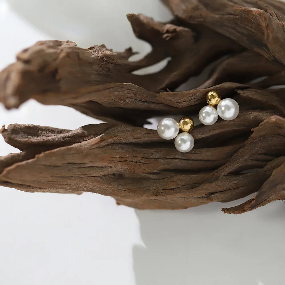 Gold-plated round pearl earrings featuring soft freshwater pearls in a trio design for classic everyday charm