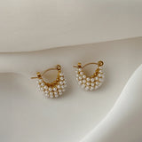 Stylish Mini Glow U Pearl Earrings, featuring gold-plated hoops and pearls, designed for a minimalist yet luxurious feel.