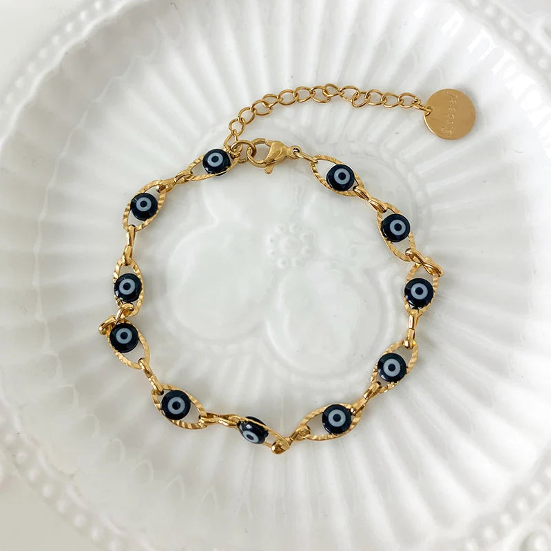 Minimalist evil eye bracelet crafted from stainless steel with colorful enamel accents for protection