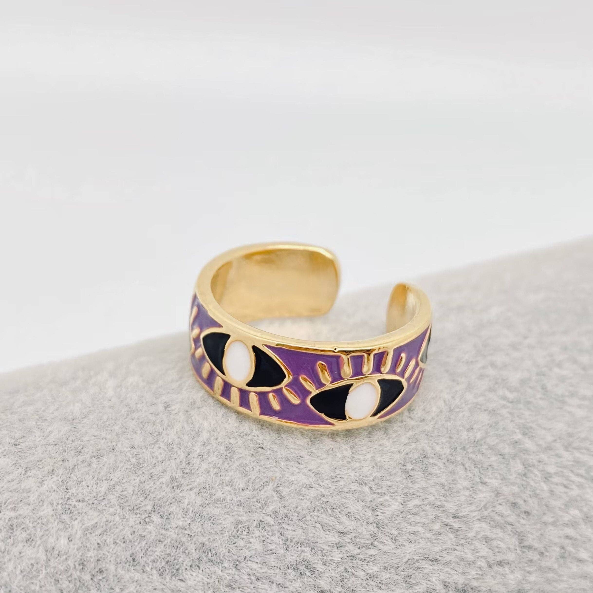 Adjustable purple enamel ring with gold and blue evil eye design, gold-plated stainless steel for style and daily protection