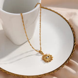Sparkling Sunburst Evil Eye Necklace with gold detailing and cubic zirconia, symbolizing protection and clarity for daily wear.
