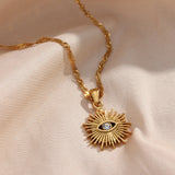 Elegant Sunray Evil Eye Necklace with gold sunburst and cubic zirconia, designed for protection, clarity, and everyday wear.