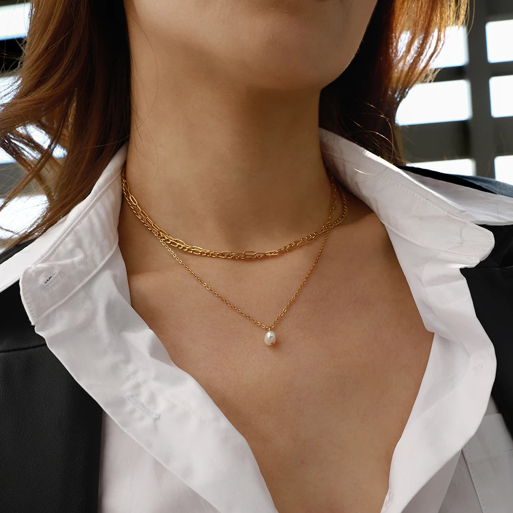 Stylish Triple Chain Natural Pearl Necklace, 18K gold-plated with a pearl drop, offering a versatile and elegant look for any occasion.