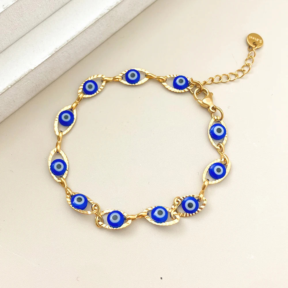 Turkish blue evil eye bracelet with colorful double-sided charms and stainless steel chain for protection and everyday wear.
