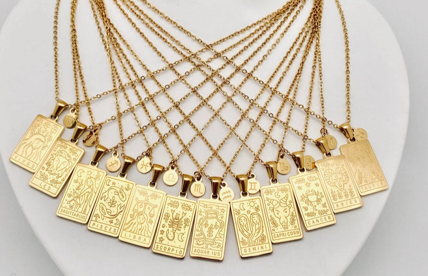 Gold necklaces with various zodiac pendants 