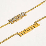 Two gold necklaces with 'mom' and 'mama' on a white background