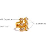 Gold ring with cubic zirconia stones on a white background