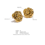 Gold rose-shaped earrings with technical details on a white background