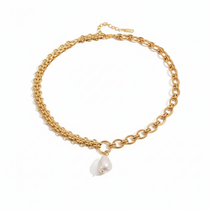 Gold chain bracelet with a pearl charm on a white background