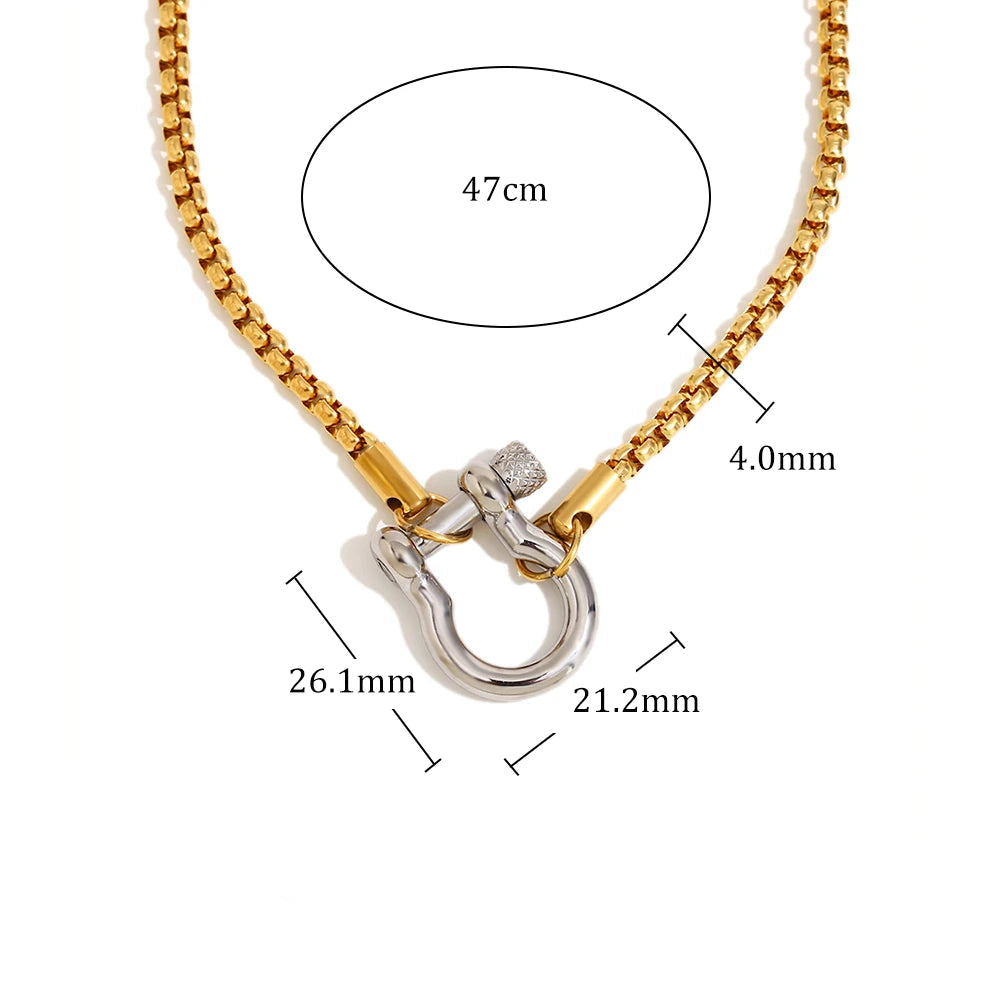 Gold necklace with a silver clasp, showing measurements and material details on a white background.