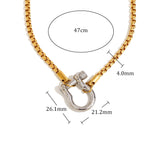 Gold necklace with a silver clasp, showing measurements and material details on a white background.