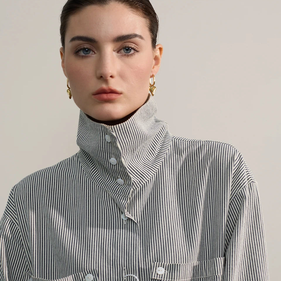 Stainless steel heart love drop hoop earrings with striped shirt display