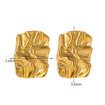 Gold earrings with measurements and weight on a white background