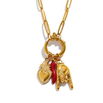 Gold necklace with charms on a white background