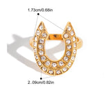 Gold horseshoe-shaped ring with clear stones, shown with measurements and product details on a white background.