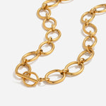 Gold chain necklace on a white background