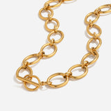 Gold chain necklace on a white background