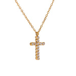 Gold cross necklace with diamonds on a white background