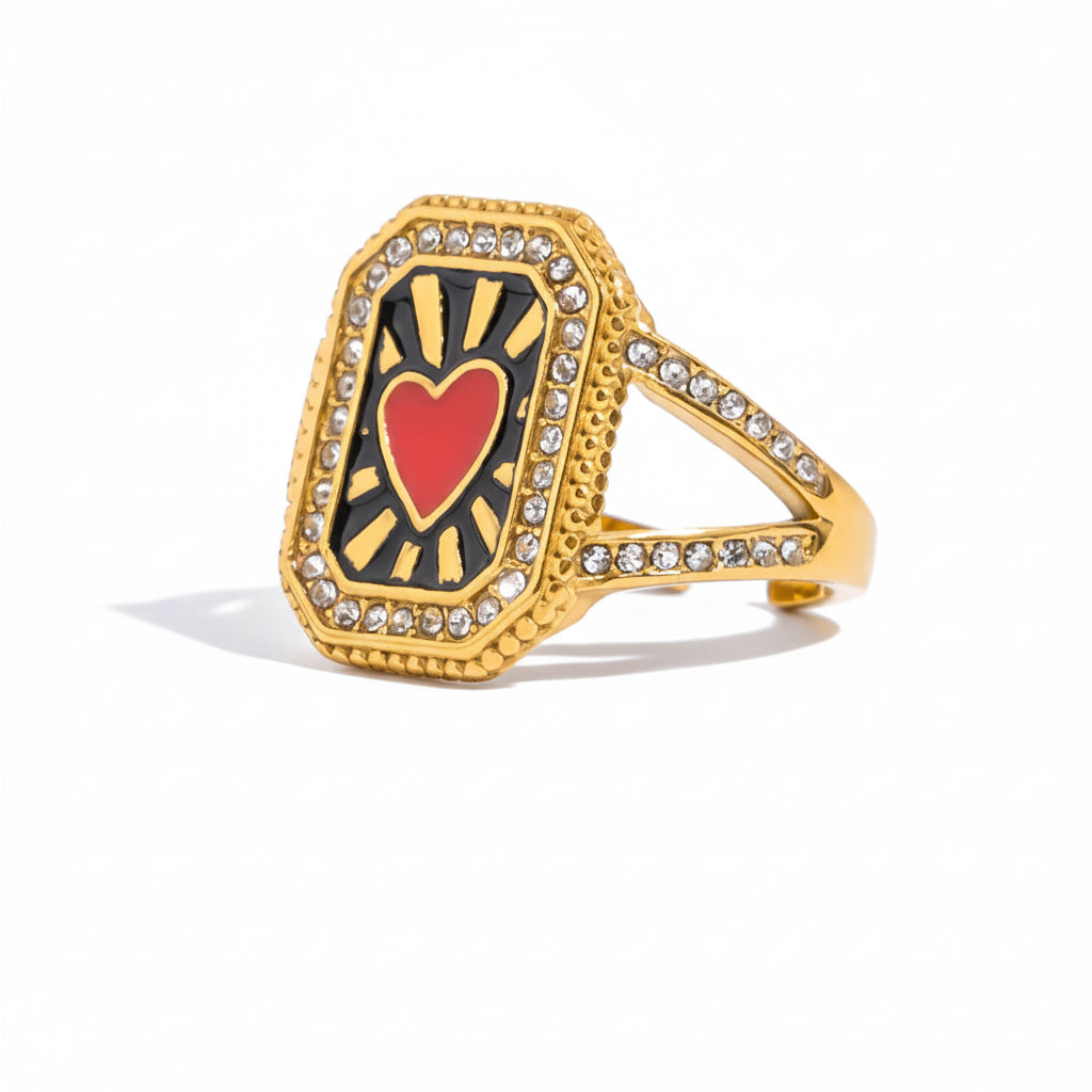 Gold ring with heart design and measurements on a white background