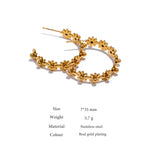 Gold floral hoop earrings on a white background with product details.