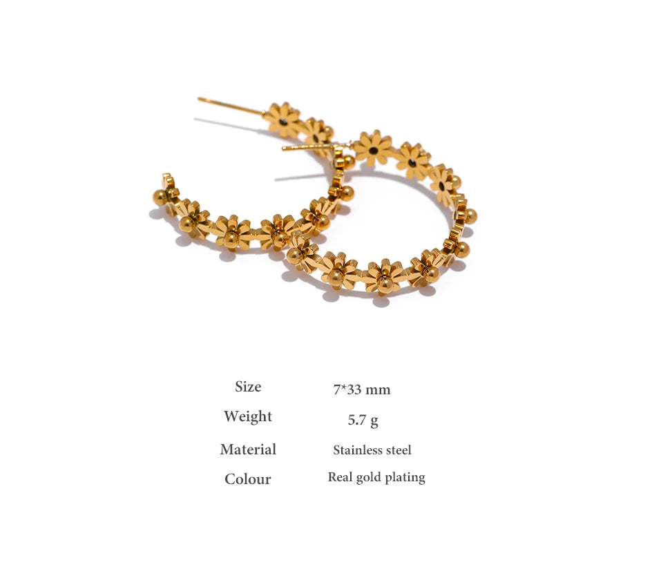 Gold floral hoop earrings on a white background with product details.
