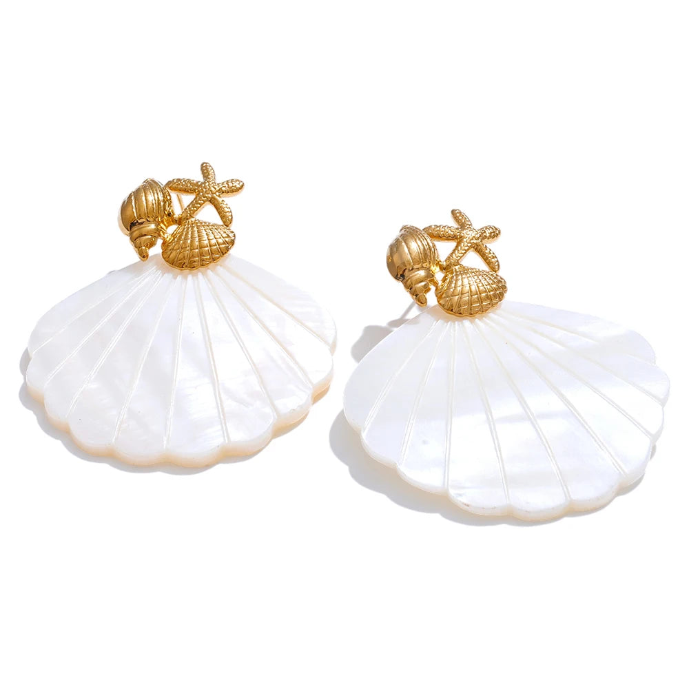 Pair of shell-shaped earrings with gold accents on a white background