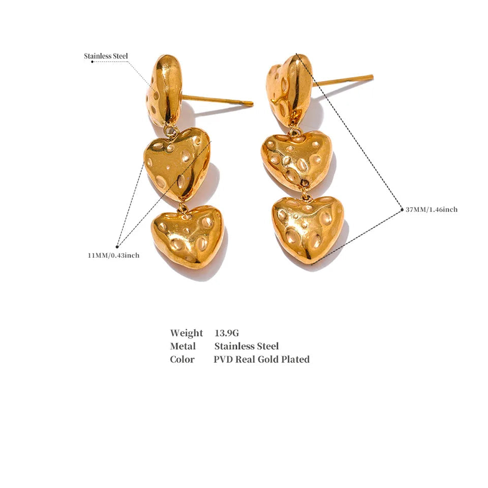 Gold heart-shaped earrings with measurement details on a white background