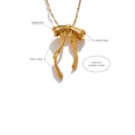 Gold bow-shaped necklace with measurements and material details on a white background