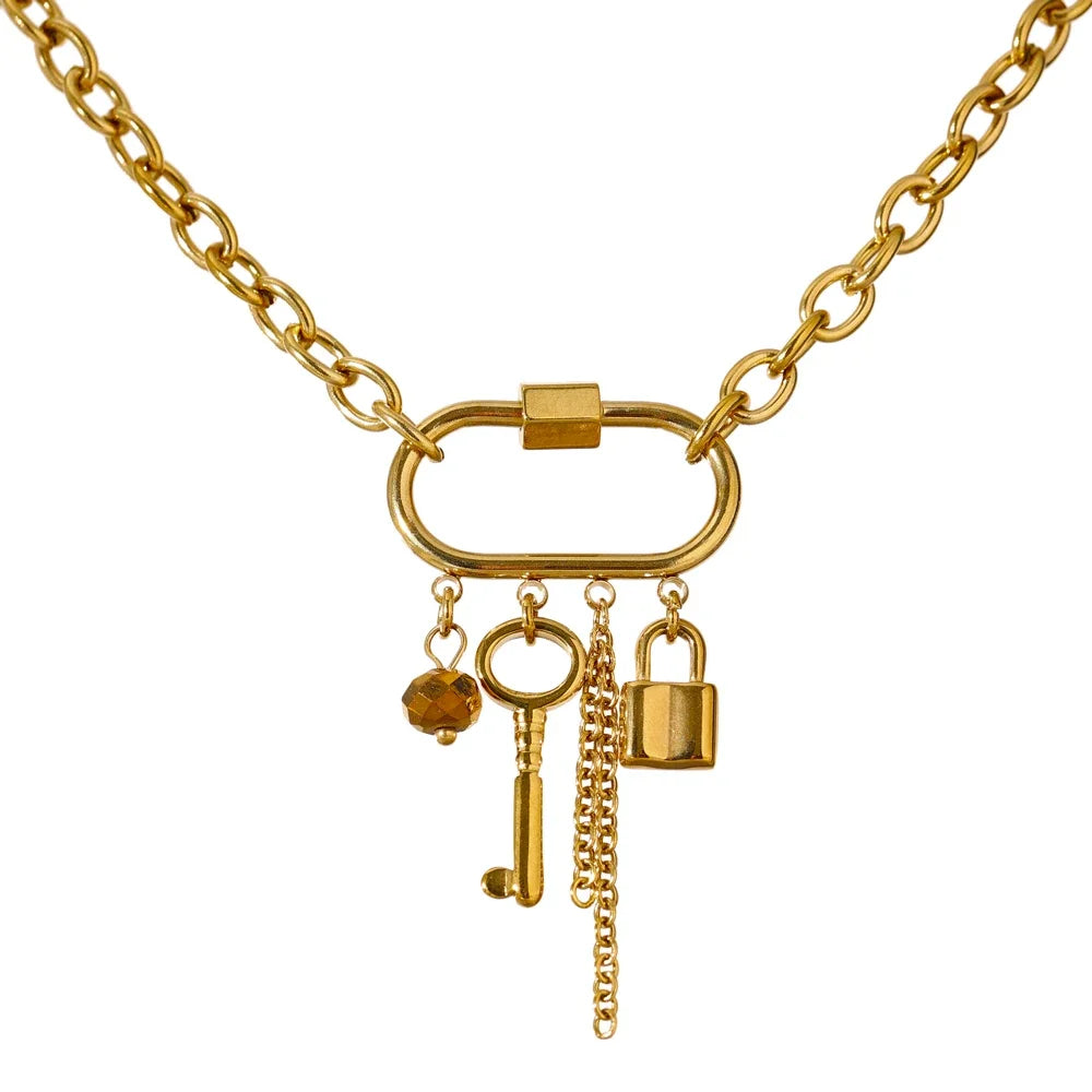 Gold necklace with charms on a white background