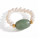 Pearl bracelet with a green stone, showing measurements on a white background