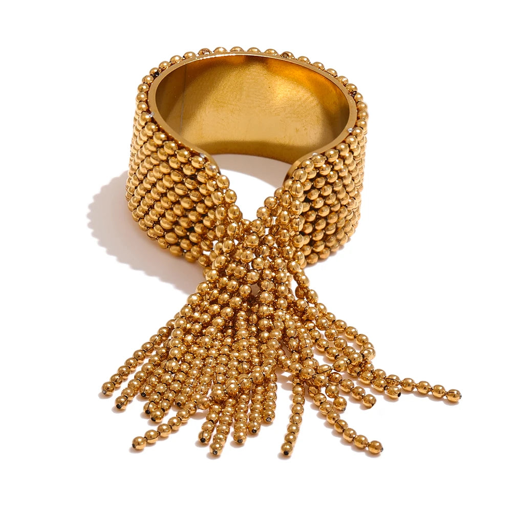 Gold-toned stainless steel beaded bangle with adjustable tassel design