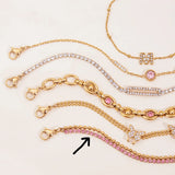 Gold and pink jewelry set on a light background