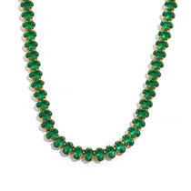 Necklace with green gemstones on a white background