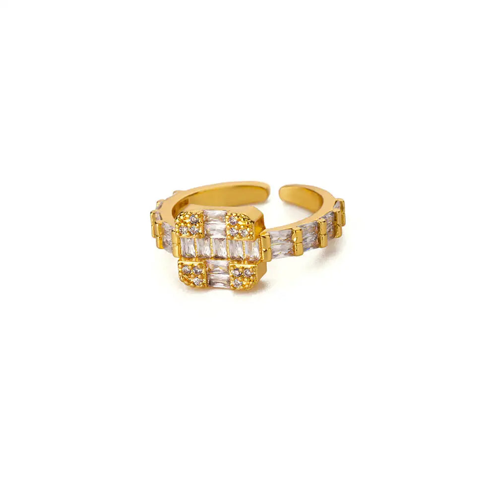 Gold adjustable square crossed ring with baguette-cut stones in a sleek, grid design, perfect for a refined and elegant statement look.