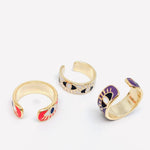 Adjustable statement ring with white enamel band and vibrant evil eye motifs, gold-plated for long-lasting shine
