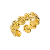 Elegant gold shell ring with adjustable design, blending seaside inspiration with everyday wearability and sparkle