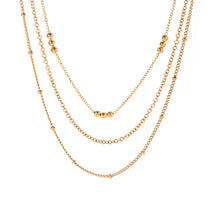 Elegant Beaded Layered Gold Necklace, 18K gold-plated with delicate chains and tiny polished gold beads, perfect for adding style and depth to any outfit.