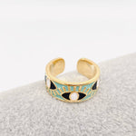 Blue enamel evil eye ring with gold details, designed for women seeking a symbolic and trendy jewelry piece