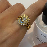 Celestial gold ring featuring sun and moon design with sparkling accents, adjustable and elegant for daily wear.